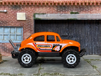 Matchbox Volkswagen Beetle 4X4 Off Road Orange Matchbox - rear angle view showing tampo details