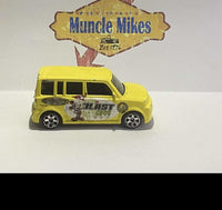 Yellow 2004 Matchbox Scion with Mickey Mouse Blast Off graphics, view 1